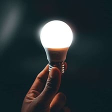 A glowing light bulb giving off light.
