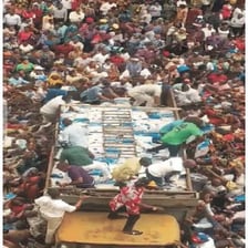 A crowded scene with many people moving in different directions