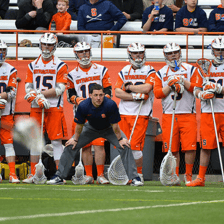 An athletic coach instructing players