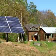 A remote cabin using independent power in a wilderness setting.