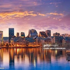 A view of Oslo, Norway, with buildings along the waterfront.