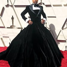 A major celebrity posing on a red carpet.