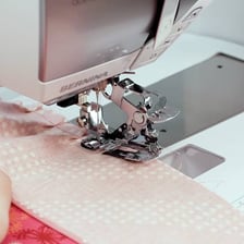 A sewn hem forming the lower border of a skirt