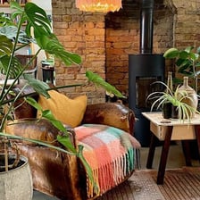 A comfortable reading nook in the corner of a room