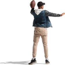 A person casually tossing a ball through the air.