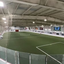 An indoor sports arena viewed from the spectator seating