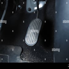 A close-up view of a vehicle accelerator pedal.