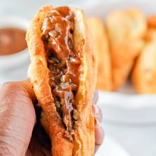 A golden fried pastry filled with seasoned potatoes.