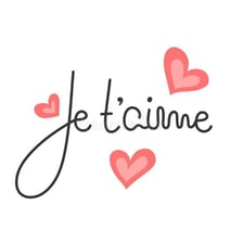 A romantic card displaying the French phrase “Je t’aime.”