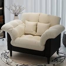 A cat scratching the upholstery of a chair