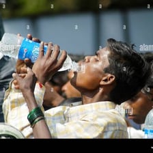 A person drinking water to satisfy thirst