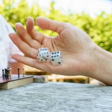 Dice being rolled across a tabletop
