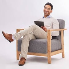 A person sitting comfortably in a chair