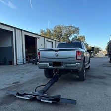 A tow truck taking away a vehicle during repossession.