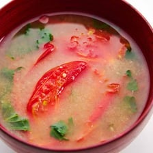 Miso soup, mushrooms, and tomatoes are shown as savory foods associated with umami.