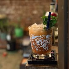A Mai Tai cocktail served in a glass.