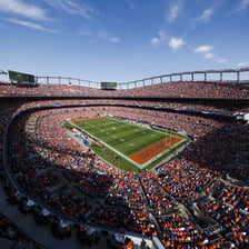 American football players competing in a stadium