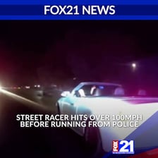 A vehicle moving dangerously fast on a roadway