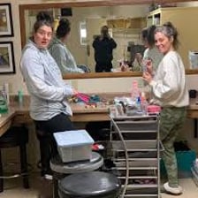 Staff members working backstage behind a production