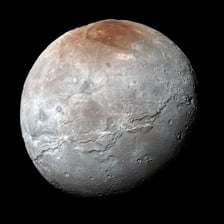 A NASA image of Pluto showing its bright heart-shaped region.