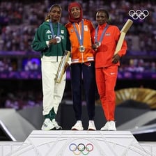 Athletes standing on an Olympic medal podium