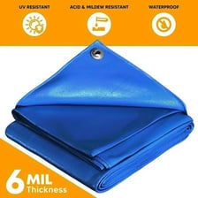 A waterproof tarp covering items outdoors