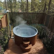 A hot tub filled with warm water outdoors.
