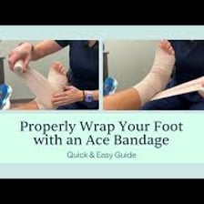 An elastic compression bandage wrapped around an injured ankle