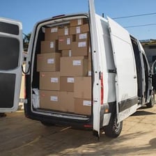 A cargo van loaded with moving boxes.