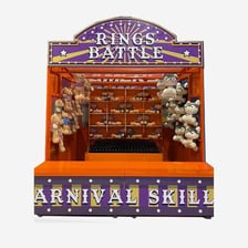 A carnival ring toss game with rings and target pegs.