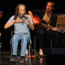 Bobby McFerrin performing on stage