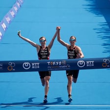 An athlete exerting maximum effort while approaching a finish line.