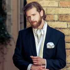 A man wearing an ascot as formal neckwear