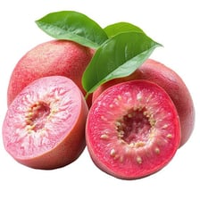 Whole and sliced fresh guavas showing their seeded centers
