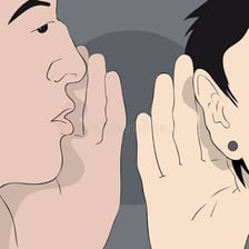 One person discreetly trying to get another person’s attention.