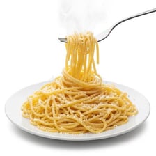 A fork holding pasta cooked al dente