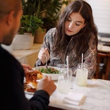 One person taking an excessive share of food from a shared table
