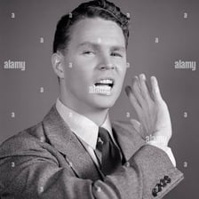 A person making a visibly dismissive expression
