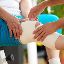 A person recovering while wearing a medical bandage.
