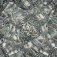 Clear ice cubes chilling a drink in a glass.