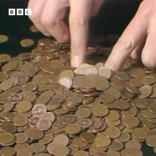A person gathering a small amount of money to cover expenses