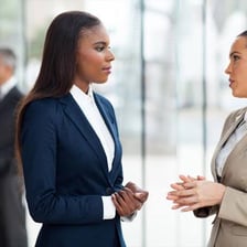Two people speaking politely during a conversation