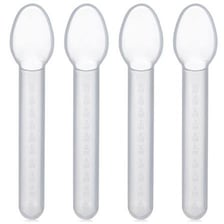 A measured dose of liquid medicine in a dosing spoon