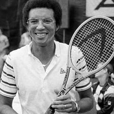 Arthur Ashe holding a tennis racket