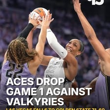 Players compete in a Las Vegas Aces basketball game.