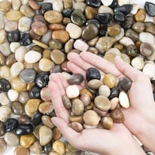 A small smooth pebble on a natural surface