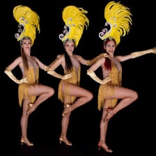 Dancers performing samba in a Brazilian ballroom setting.