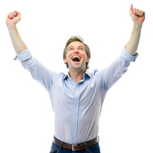 A joyful person celebrating with raised arms