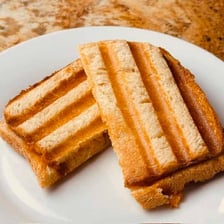 A toasted panini with pressed grill marks