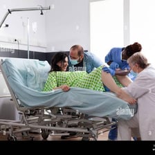 An obstetrician assisting with a hospital childbirth
